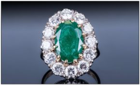 18ct Gold Set Emerald and Diamond Cluster Ring, The Central Faceted Emerald Surrounded by 12 Round