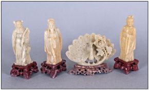 Collection Of Four Small Jade Style Figures On Carved Wooden Bases comprising peacock & three