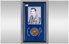 Framed Photograph Of Elvis Presley Together with a strand of Elvis` hair. 22x12``