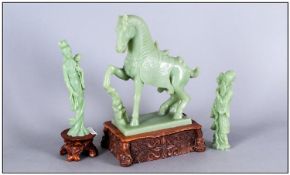 Three Jade Style Figures On Carved Wooden Plinths, One of a horse, one a sage & one a lady carrying