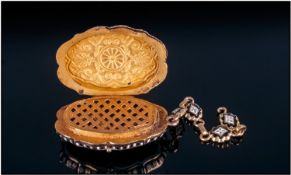 19th Century Continental Enamelled Vinaigrette of shaped form with all over gilt, black & white