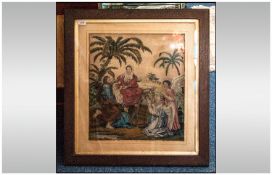 Victorian Needlework Sampler Picture depicting the Holy family with attendant angels. In oak frame.