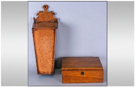 An Antique Oak Wall Hanging Candle Box, with a shaped fretted top, with a lift up lid. Together