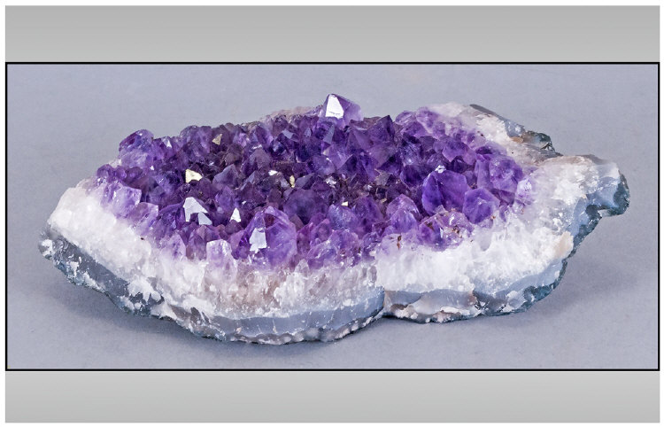 Amethyst Geode, with spread of colour from mid purple to pale lilac, roughly marquise shaped piece,