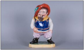 An Unusual Antique Staffordshire Of A Cavalier Standing, the head lifts off to form a container,