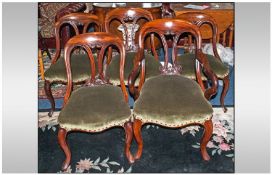 A Set Of 5 Fine Quality Mahogany Dining Chairs with a tub shaped carved back, on cabriole type
