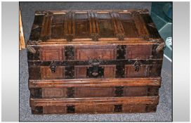 Large Leather Covered Trunk Bound in steel and oak with leather handles.
