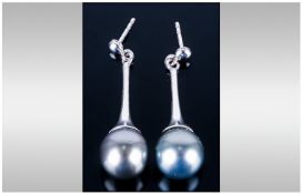 Pair Of Ladies Pearl Set Drop Earrings, Each with a single Black Pearl suspended below a tapering
