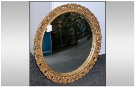 Circular Mirror with Gilt Frame and Convex Glass 20 inches in diameter.