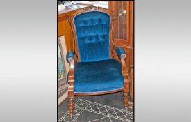 Victorian Open Walnut Armchair with a padded button back and carved top rail. With scroll arms and