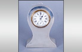 A Small Silver Cased & Shaped Desk Clock Hallmark Birmingham 1919. Stands 3.5`` in height, Working