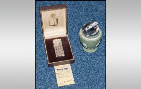 Dunhill Plated Cigarette Lighter in fitted case together with a Wedgwood Jasperware Table Lighter.