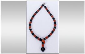 Ladies Art Deco Egyptian Revival Snake/Serpent Necklace. Formed with alternating black & orange