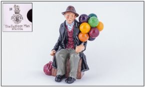 Royal Doulton Early Figure ``The Balloon Man`` HN 1954. Height 7.25 inches. Slight restoration to