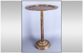 A Large Brass Cake Stand, 17 inches high.
