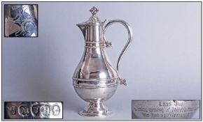 Victorian Pugin Style Silver Wine Jug, with a beak spout, surmounted by a cross, with tapered belly