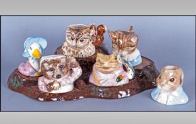 John Beswick Beatrix Potter Figure Heads with Beswick Tree Trunk Plinth  Comprising Jemima Puddle-