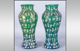 Pair Of Loetz Type Glass Vases, the body decorated with a ribbed moulded decoration in green picked