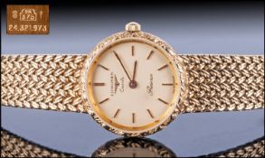Ladies 9ct Gold Longines Wristwatch 21mm round case, gilt dial and baton numerals. Quartz movement,