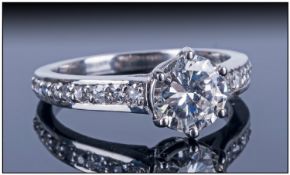 Ladies White Gold Diamond Ring Set with a central round brilliant cut Diamond, claw set, Estimated