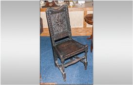 Early Carved Oak Stand Chair with a carved shaped back panel, on shaped baluster legs with cross