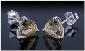 Pair of Green Gold Quartz Stud Earrings, each a trillion cut solitaire of the Brazilian mined,
