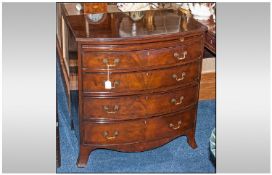 Reproduction Mahogany Bow Fronted Bachelors chest in the Georgian style, with brass drop snake