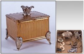 Ladies Gilt Metal Rigu Musical Trinket Box, hinged lid with marcasite set finial containing three