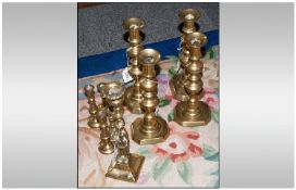 Four Pairs Of Knopped Corinthian Style Brass Candlesticks. plus one other.
