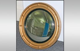 Port hole Mirror. Housed in a Gilt frame. 20 inches in diameter, mirror with 14 inches.