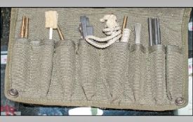 Military Interest. Green Canvas Bag containing what appears to be gun cleaning implements.
