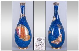 Carlton Ware, Lustre Vase. Butterfly Design on Dark Blue Ground, Chip to rim. Height 9 Inches.