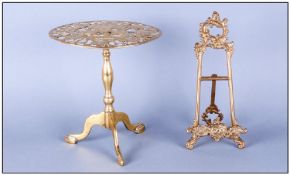 Brass `Tripod Table` Trivet, the pierced top with bird and grape decoration, plus easel style