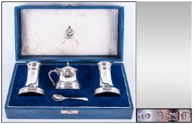 Cased Art Deco Three Piece Silver Cruet Set, salt & pepper of Turret form with round ribbed base.