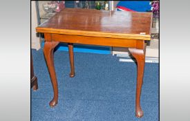 A Walnut Veneered Queen Anne Style Fold Over Top Card Table one queen legs of rectangular form.