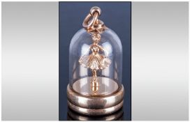 A Vintage 9ct Gold Pendant With Wind Up Dancing Ballet Dancer in a glass dome. Fully Hallmarked 9.