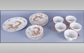 Oriental Part Tea Set.  Dragon decoration to white ground. Comprises of 5 tea pots, 6 saucers, 6