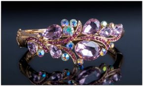 Pink, Magenta and Aurora Borealis Crystal Bangle, a hinged oval, with a snap shut action with a