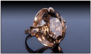 9ct Gold Set Single Stone Smoky Topaz Dress Ring, Fully hallmarked. Circa 1970`s. The faceted Topaz