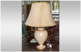 Contemporary Table Lamp with cream base and shade. 26 inches high.