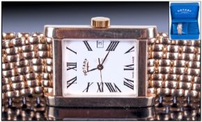 Rotary 9ct Gold Gents Date Watch, tank shaped, with a heavy integal 9ct gold mesh bracelet. Quartz