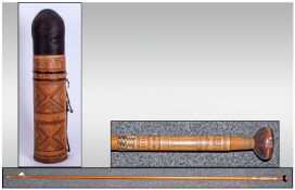 Oriental Blow Pipe together with a Quiver of arrows. Blow Pipe 82`` in height.