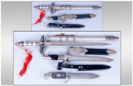 Display Purposes Only Comprising Three German WW2 Style Daggers/Knives and Scabbards.