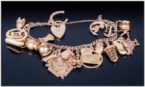 9ct Gold Ladies Vintage Charm Bracelet loaded with 21 charms of good quality. Fitted with padlock.