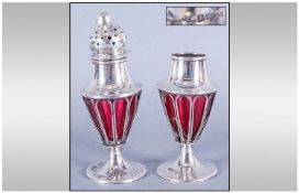 Pair Of Art Nouveau Silver & Ruby Glass Pepperettes, Hallmark Birmingham, date letter rubbed. Each