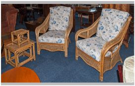 Pair Of Contemporary Conservatory Lounge Chairs with blue upholstered cushions and matching nest of