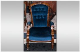 A Late Victorian Walnut Framed Gentlemans Armchair with open padded arms, shaped back. On turned