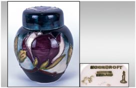 Moorcroft Small Lidded Ginger Jar, Magnolia, Pattern In White and Purple Colour way on Blue Ground.