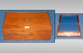 Victorian Rosewood Travelling Writing Slope, The hinged top with brass banding and cartouche.
