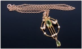 Ladies Early 20th Century Openwork Pendant set with an oval cut green faceted stone & seed pearls.